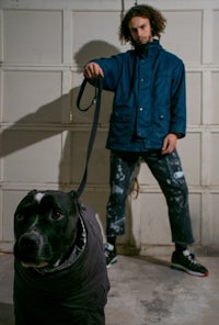 a man with a dog on a leash